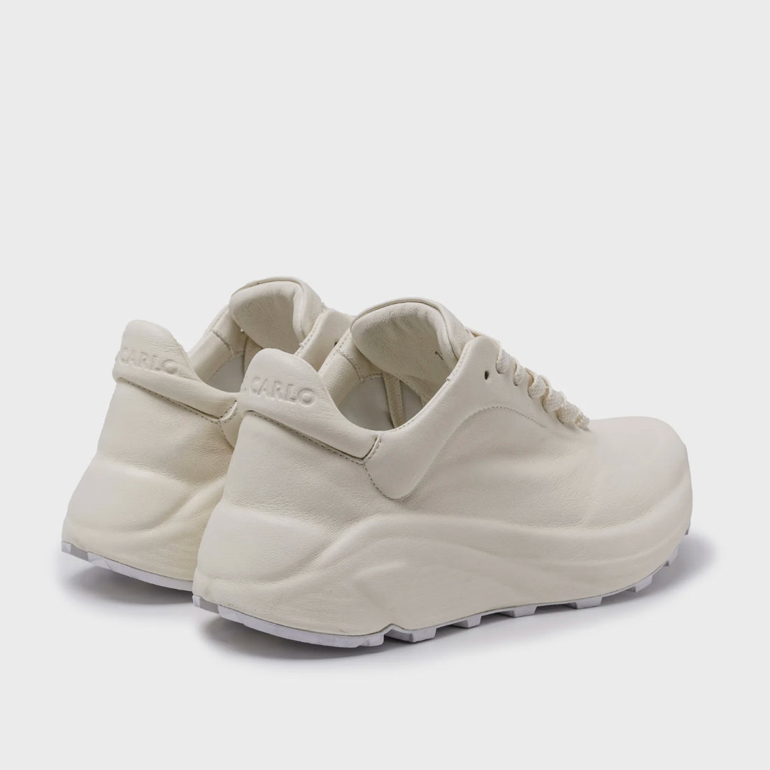 White sneaker on a light gray background