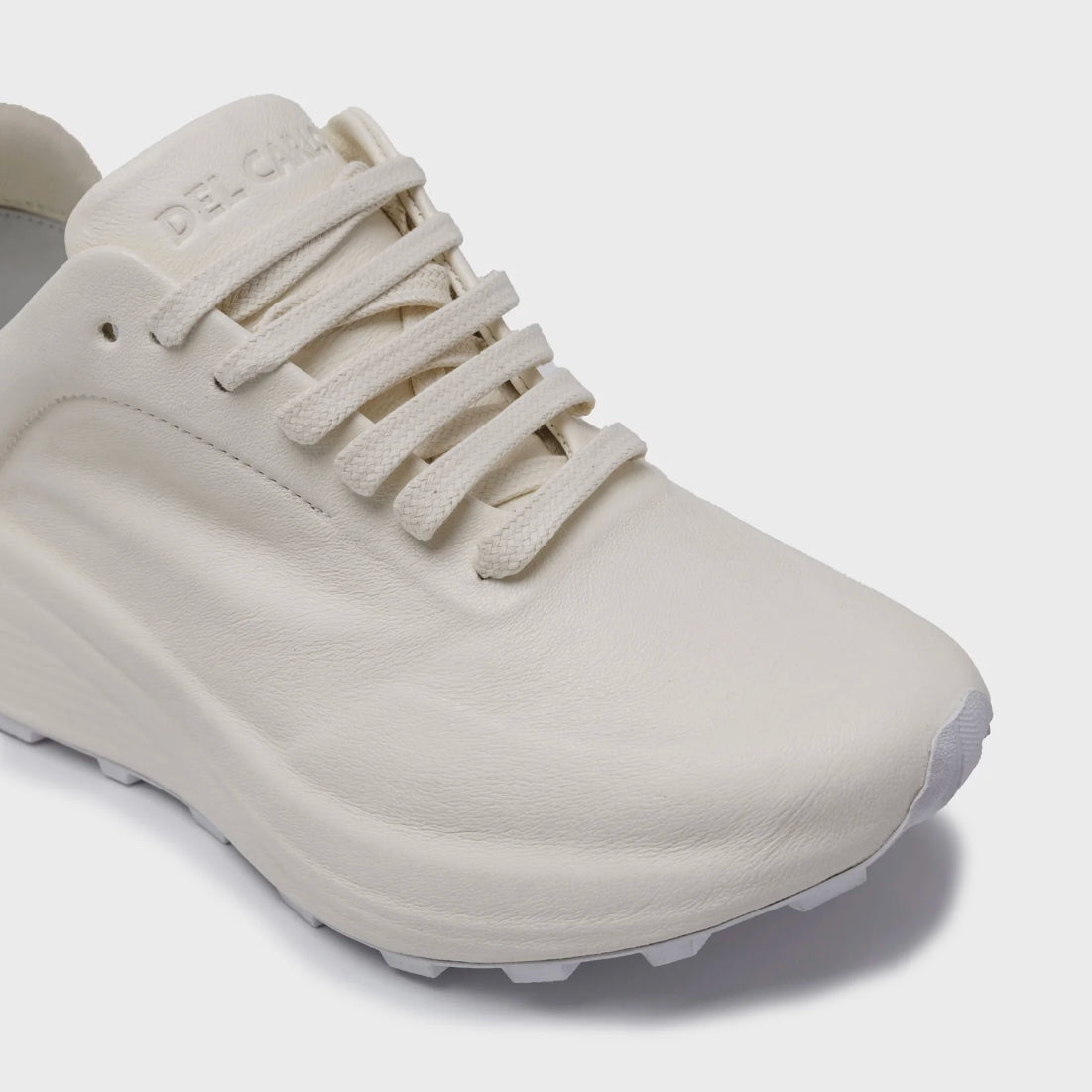 White sneaker on a light gray background